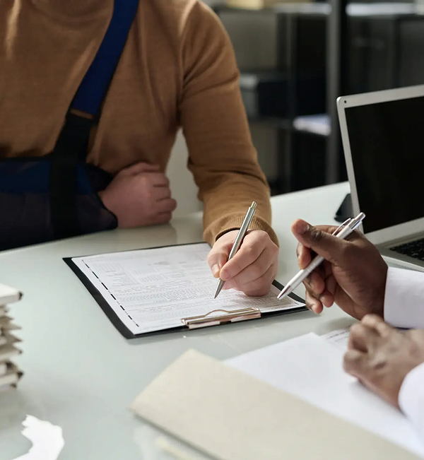 Two people at a desk looking at document
