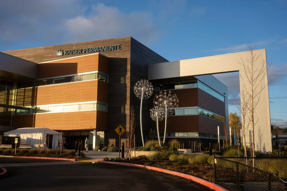 Front entrance of the new hospital building, featuring modern architecture and welcoming landscaping.